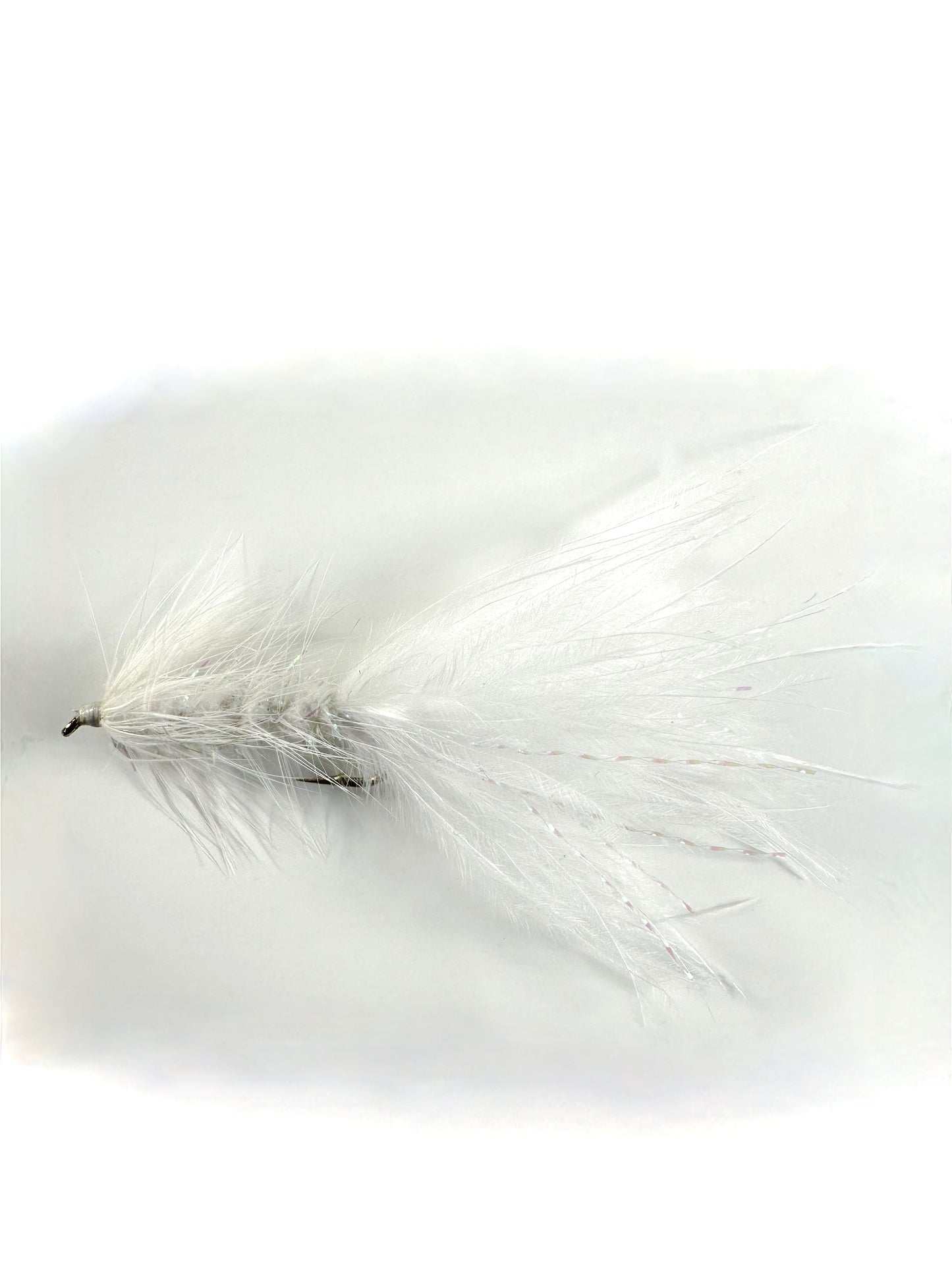 White Crystal Woolly Bugger fly—a versatile and effective fly fishing lure for catching trout, bass, and other freshwater game fish.