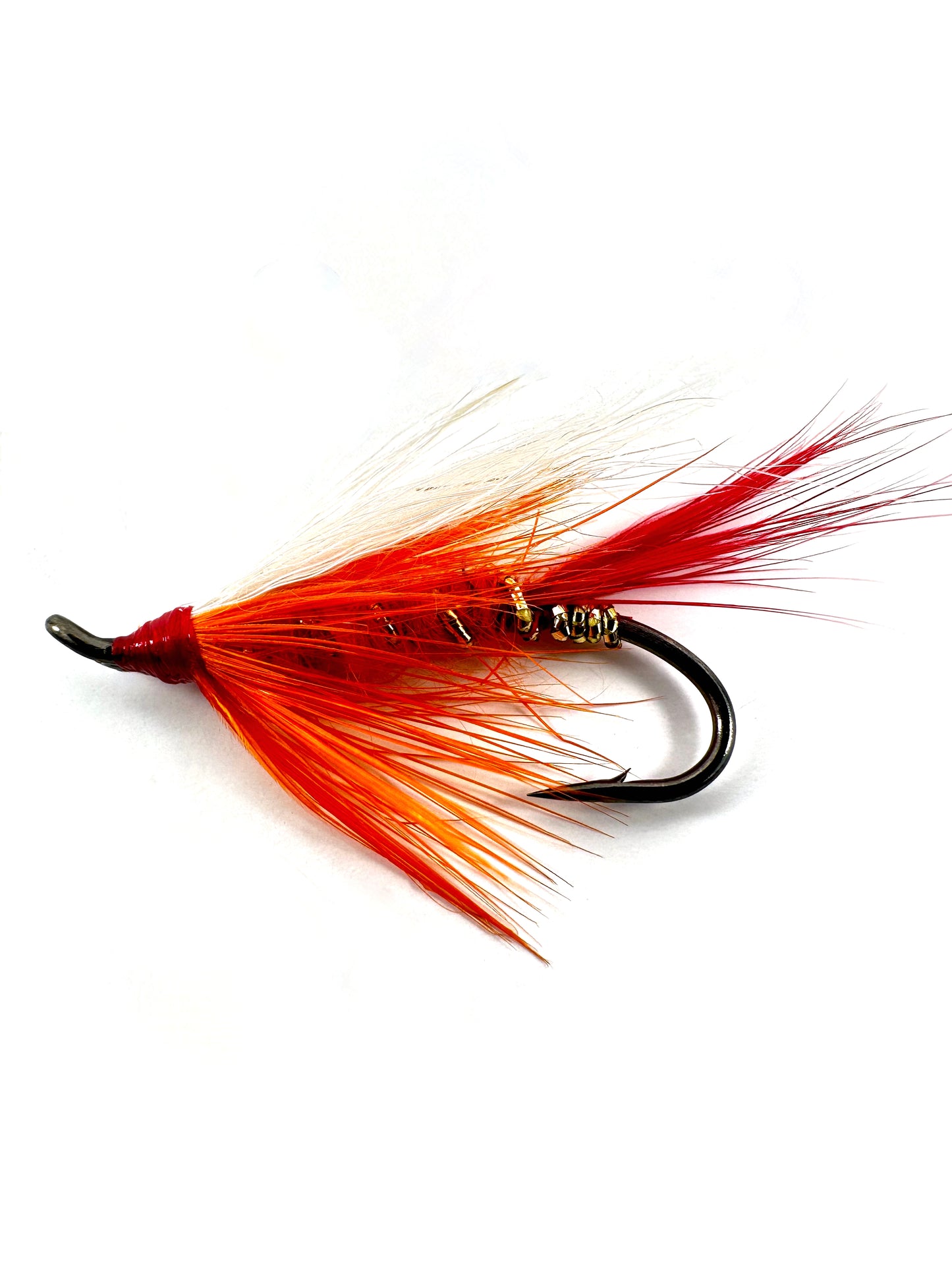 Polar Shrimp Fly—a bright orange and white fly fishing lure for catching salmon, steelhead, and trout in freshwater rivers.
