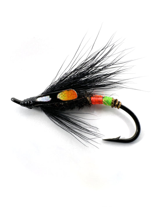 Undertaker Spey Fly for fly fishing, expertly hand-tied to target salmon, steelhead, and trout. Featuring a classic black and junglecock pattern, this Spey fly is perfect for swinging through rivers and streams. Designed with durable materials for long-lasting use in challenging fishing conditions. High-quality Undertaker Spey Fly for effective fly fishing presentations and attracting aggressive strikes.